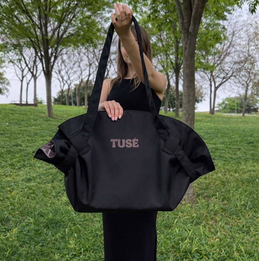 Black tote held up