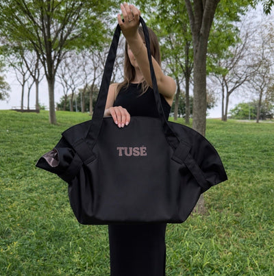 Black tote held up