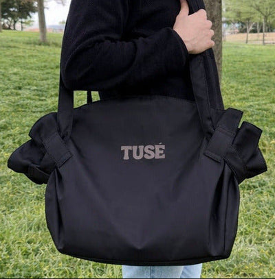 Black tote on shoulder
