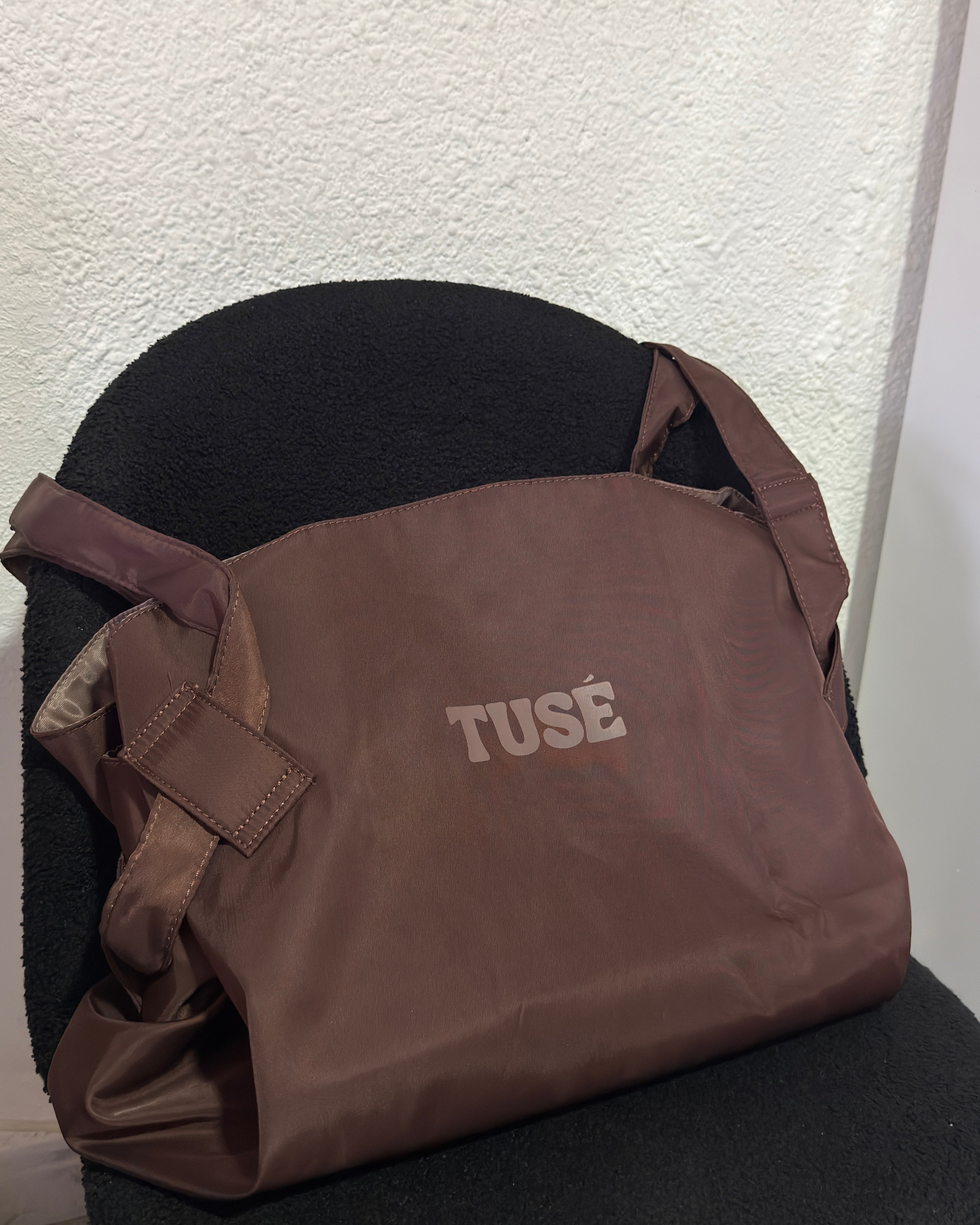 Brown tote on a chair